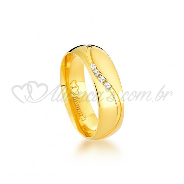 Par de alianas trabalhadas com brilhante em ouro 18k - 750. Ideal para noivado e casamento