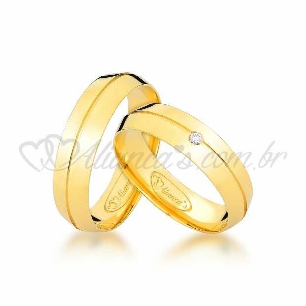 Par de alianas com brilhante em ouro 18k - 750