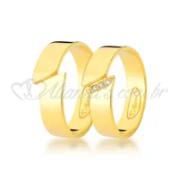 Par de alianças com brilhante de noivado trabalhada no ouro 18k - 750