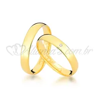 Alianças com brilhante em ouro 18k - 750. Modelo tradicional.